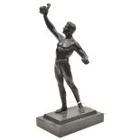 A German bronzed spelter prize statuette of a near naked athlete holding aloft a laurel wreath, on a