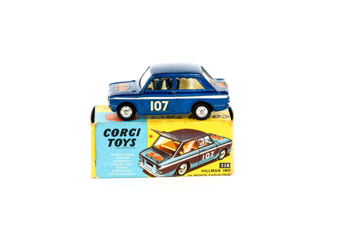 A Corgi Toys Hillman Imp 'Monte Carlo 1966' (328). An example in metallic blue with rally plaques,