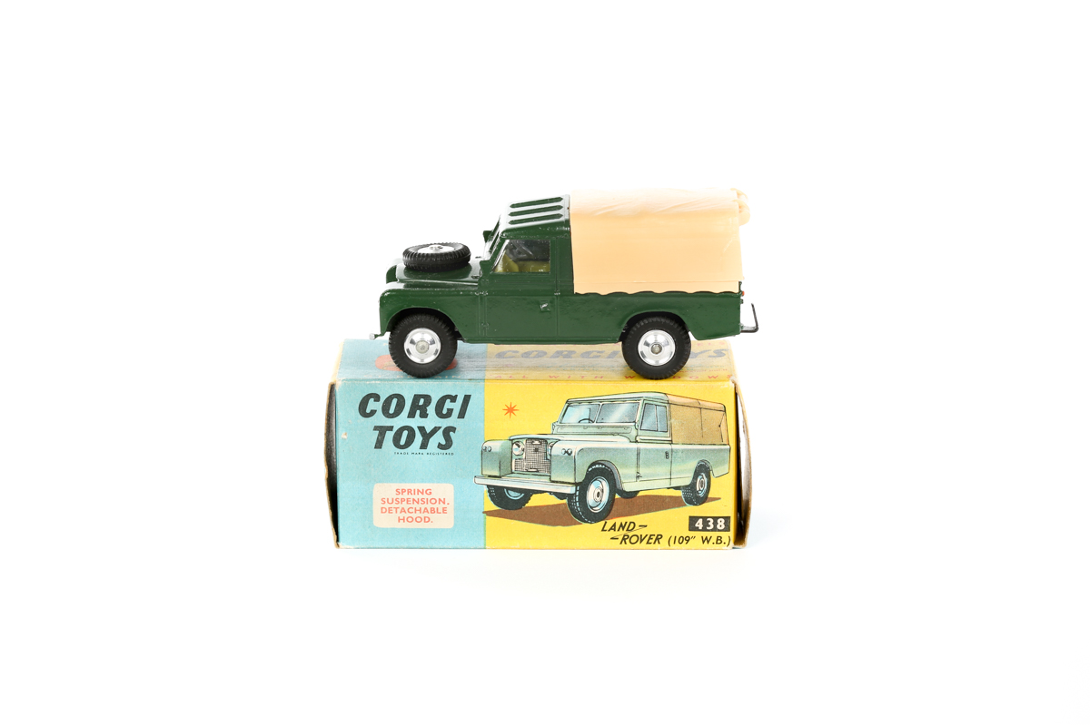 A Corgi Toys Land Rover (109" W.B.) (438). An early example of the type in dark green with lemon