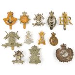 12 ERII yeomanry cap badges, and 3 collars. GC