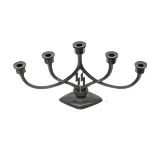 A Third Reich SS 5 branch candlestick, of blackened cast iron with entwined stems of diamond