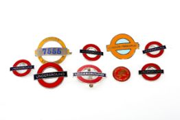 9 London Transport badges. 3 cap badges; a conductors badge and 2 platform staff badges and 6