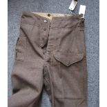 A pair of WWII Canadian issue khaki BD trousers dated 1945 Fev. VGC (couple of small moth holes)
