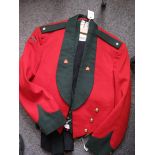 A scarce post 1902 Rhodesia Regiment officer’s mess dress comprising: green faced scarlet jacket