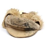 A Third Reich special issue Luftwaffe Russian front peaked cap, of fur lined soft white leather with