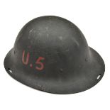 A scarce WWII period Eastern European steel helmet, raw edged with 3 slots for camouflage netting