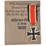 A 1939 Iron Cross 2nd class, with ribbon, GC, in its printed paper packet, marked to “SS Pz