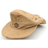 A WWII pattern German pale buff soft peaked cap, with wool embroidered Luftwaffe eagle, and cockade.