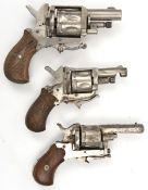 A 6 shot .22” rimfire blank cartridge revolver, with folding trigger and plain wood grips; another