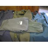 A Coldstream Guards blue/grey greatcoat, with anodised buttons; a Royal Artillery khaki greatcoat