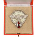 A Third Reich Hitler Youth Gausieger badge, dated 1943, in silver plate and enamel, by “A G Tham