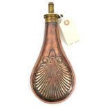 A large shell embossed copper powder flask, 10” overall, the patent top stamped “Patent”, GC (the