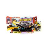 A first issue Corgi Toys Batmobile (267). An example in gloss black with Batman and Robin figures