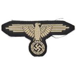 A Third Reich French made late war woven silk SS arm eagle. GC