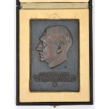 A Third Reich rectangular bronzed plaque, 3¾” x 5½”, embossed with bust of Hitler and “Die