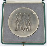 A Third Reich worker’s long service medallion, 80mm, of frosted white metal, depicting on one side a