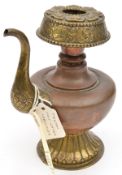 A Tibetan brass and copper holy water sprinkler, “Coffee pot” body and slender spout, flared
