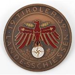 A Third Reich circular bronze shooting badge, 52mm, the centre bearing red enamelled eagle above