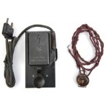 A WWII German Morse key, mounted on a steel plate, with cable and plug (cable perished), and a small