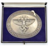 A Third Reich NSFK oval silvered metal plaque, 3¾” x 3”, the centre with NSFK “bird man” device,