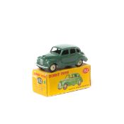 Dinky Toys Austin Devon Saloon (152). A scarce example in dark sage green with cream wheels and