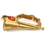 A small brass bugle, with applied ERII R Artillery badge (worn), mouthpiece on chain, multi coloured