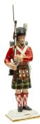 A painted porcelain figure “Private 93rd Regiment” in full dress and equipment, shouldering arms,