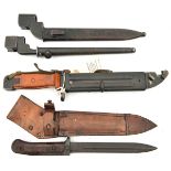 A No 9 Mk 1 bayonet; a No 4 Mk II bayonet; a Czech M1958 bayonet; and another; all in scabbards.