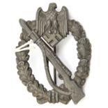 A Third Reich infantry assault badge, no maker’s name but probably Sohni Heubach & Co Oberstein. GC