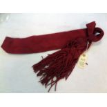 An officer’s scarlet 3” braid shoulder sash and tassels. GC