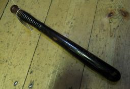 A Vic hardwood truncheon, with ribbed grip, maker’s mark on pommel of “Field Tavistock St. WC”