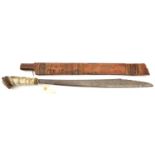 A Borneo headhunter’s sword, swollen blade 21”, with non original horn grip, in raffia bound