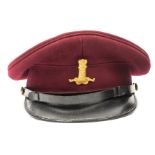 An officer’s crimson cloth peaked cap of The 11th (Prince Albert’s Own) Hussars, black PL