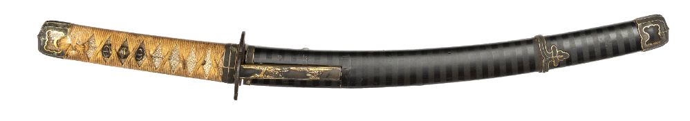 A Japanese sword wakizashi, curved unsigned blade 13¾”, copper habaki, kodsuka hilt with trees