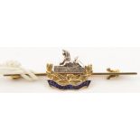 A WWI period enamelled “15 ct” tie pin brooch of The Gloucestershire Regt. VGC