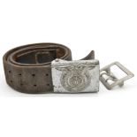 A Third Reich late war SS leather belt with silver painted steel man’s buckle; also an Army