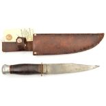 A Third Reich period sheath knife, 4¾”, clipped back blade, alloy pommel, leather grip, marked “