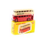 Dinky Toys Double Deck Bus (290). Example in cream and red, with 'DUNLOP The Master Tyre' adverts to