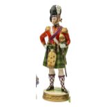 A “Kingsman Collection” painted porcelain figure “Officer 1846” of The Royal Highlanders, standing