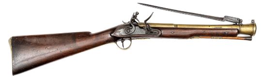 A late 18th century brass barrelled flintlock blunderbuss with spring bayonet, 30½” overall, 2 stage