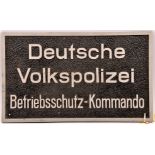 A German aluminium wall plaque 19½” x 11½”, with embossed polished lettering and border on rough