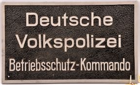 A German aluminium wall plaque 19½” x 11½”, with embossed polished lettering and border on rough