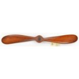 A small laminated wooden propeller blade from a c 1920s or 1930s aircraft, 22” diameter with central