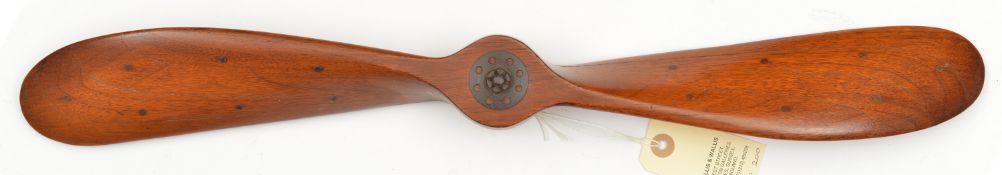A small laminated wooden propeller blade from a c 1920s or 1930s aircraft, 22” diameter with central