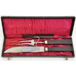 A Third Reich officer’s mess carving set, the knife blade stamped “Curdts Nache Solingen”, the