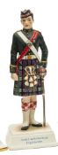 A “Kingsman Collection” painted porcelain figure “Argyll & Sutherland Highlanders” in full dress