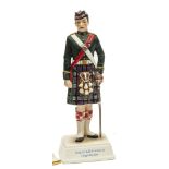 A “Kingsman Collection” painted porcelain figure “Argyll & Sutherland Highlanders” in full dress