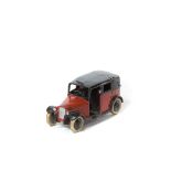 A rare Dinky Toys Taxi (36g). An example in red and black with open rear window, black smooth wheels