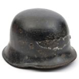 A Third Reich M34 police type Luftschutz combat helmet, with 2 sets of 7 hole air vents and