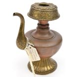 A Tibetan brass and copper holy water sprinkler, “Coffee pot” body and slender spout, flared